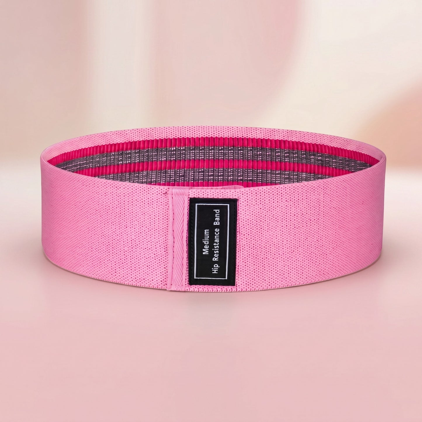 TBF Home fitness pink fabric hip resistance band with grey and pink stripes, size medium.