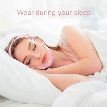 TBF Home fitness pink V-line face mask with adjustable straps, worn by a woman sleeping in bed for jawline support.